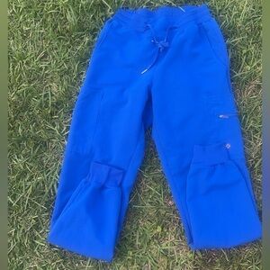 White cross scrub joggers